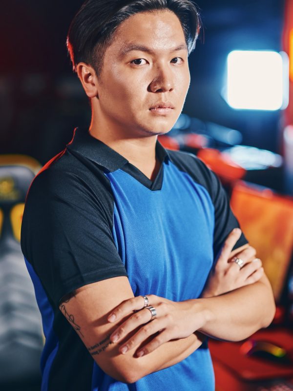 vertical-shot-of-young-asian-guy-male-cyber-sport-gamer-keeping-arms-crossed-and-looking-at-camera.jpg