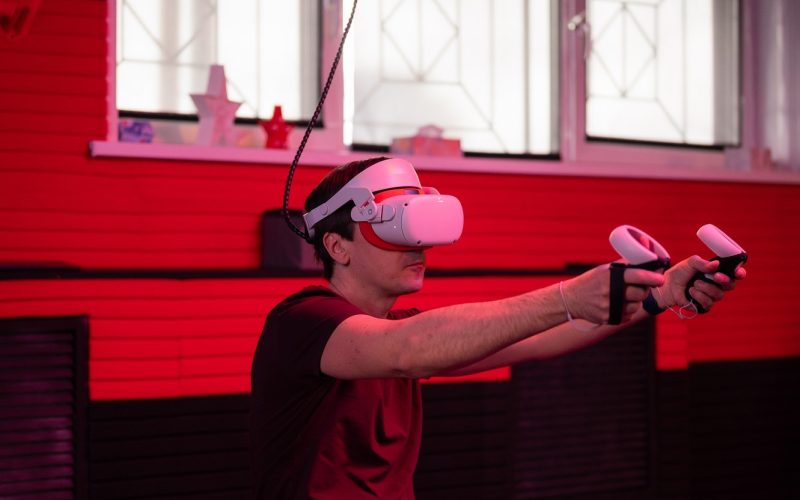 vr-game-and-virtual-reality-adult-man-gamer-in-3d-glasses-playing-on-shooting-simulation-video-game.jpg